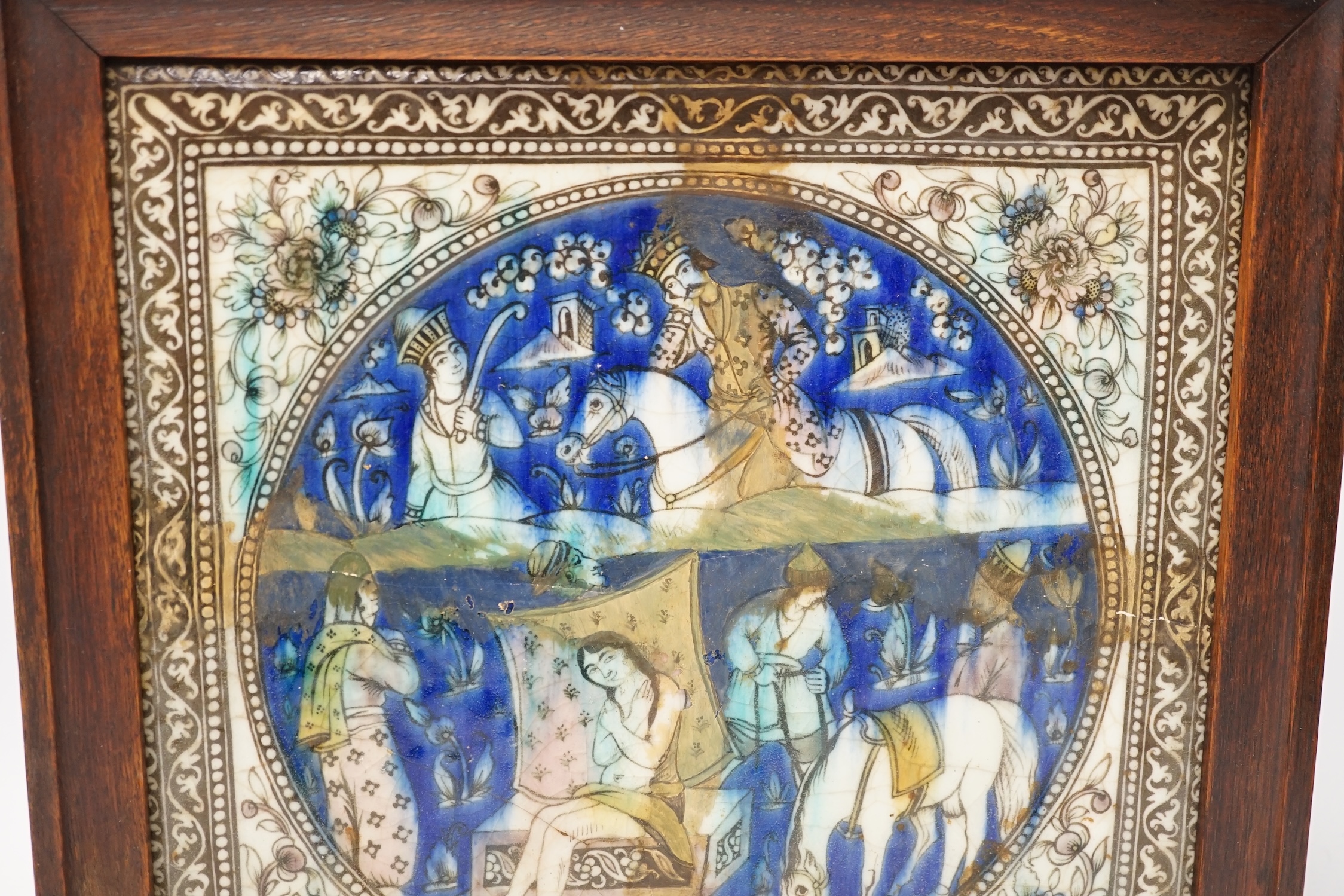 A large framed Persian fritware tile, Qajar dynasty, frame 36cm sq. Condition - heavily restored